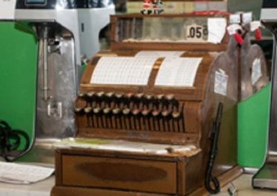 An old, wooden cash register on display at Guerin's Pharmacy in Summerville, SC